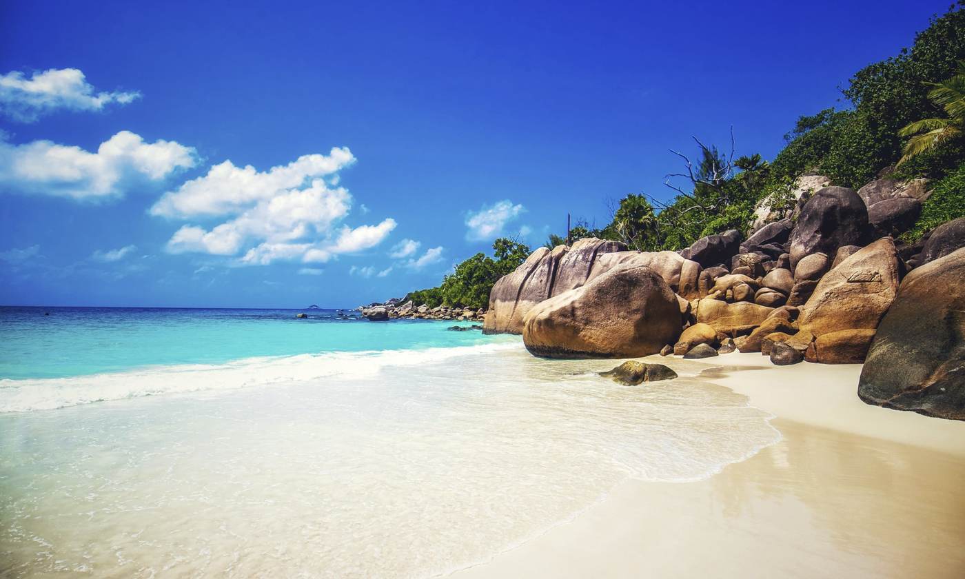 Granite boulders and white sand beach in the Seychelles