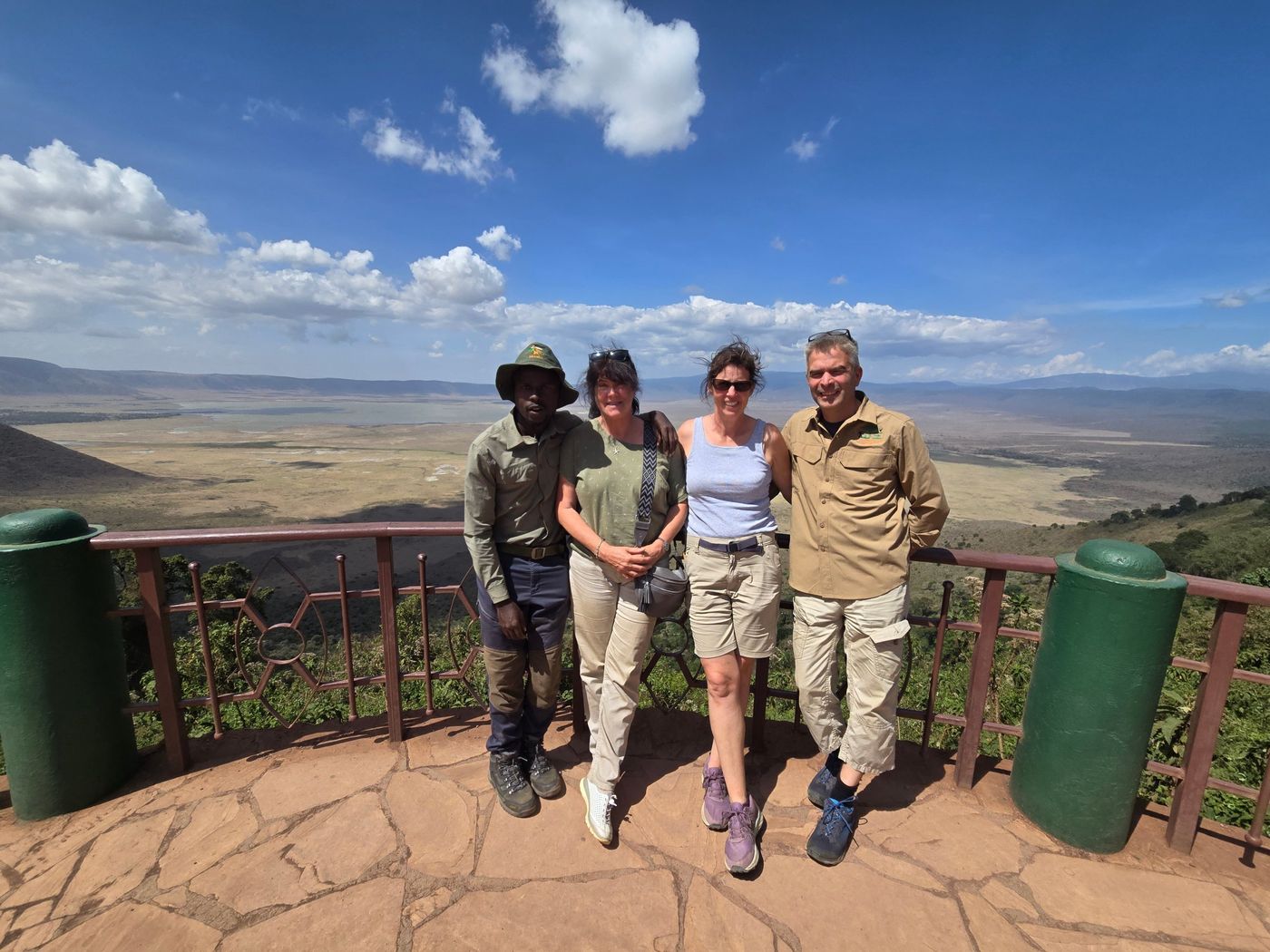 Guests and guide at a viewpoint over the Ngorongoro Crater